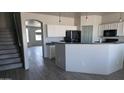 Bright kitchen featuring white cabinets and modern appliances, perfect for cooking and entertaining at 18174 E Via Jardin --, Gold Canyon, AZ 85118