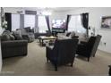 Inviting living room with a mix of comfortable seating, complemented by natural light, and ideal for entertaining at 2359 S Tomahawk Rd, Apache Junction, AZ 85119