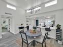 Charming dining area with stylish table, modern lighting, and adjacent kitchen with bar seating at 3401 N 37Th St # 14, Phoenix, AZ 85018