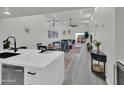View of the dining and living areas from the kitchen, showcasing the home's open floor plan at 3401 N 37Th St # 14, Phoenix, AZ 85018