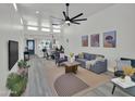 Open-concept living room with high ceilings, modern furnishings, and abundant natural light at 3401 N 37Th St # 14, Phoenix, AZ 85018