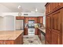 Inviting kitchen with stainless steel appliances, granite countertops, and ample cabinet space at 4441 E Desert Wind Dr, Phoenix, AZ 85044