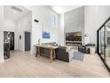 Bright open concept living room with high ceilings, fireplace, and modern decor at 5401 N 25Th St, Phoenix, AZ 85016