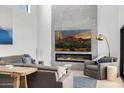 Cozy living room featuring a linear fireplace, comfortable sofas, and modern artwork at 5401 N 25Th St, Phoenix, AZ 85016