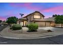 Inviting home on a corner lot with manicured landscaping and a three-car garage at 664 E Windsor Dr, Gilbert, AZ 85296