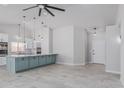 Open concept kitchen with a center island, modern pendant lighting, and stainless steel appliances at 676 W Shawnee Dr, Chandler, AZ 85225