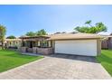 Beautiful home featuring a brick driveway and a cozy, covered front porch at 7802 N 6Th St, Phoenix, AZ 85020