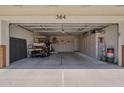 Spacious two-car garage featuring ample built-in storage and room for a golf cart, ideal for organization at 8160 E Keats Ave # 364, Mesa, AZ 85209