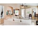 Bright living room with a comfortable sofa and view of the outdoor pool area at 9248 E Blanche Dr, Scottsdale, AZ 85260
