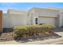 Front exterior showcasing desert landscaping and a stucco facade at 11079 N 110Th Pl, Scottsdale, AZ 85259