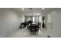 Open-concept dining room with marble floors and access to a potential office space at 11250 N 33Rd Ave, Phoenix, AZ 85029