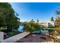 Relaxing patio with stone floor and a view of the serene waterfront at 1134 E Driftwood Dr, Tempe, AZ 85283