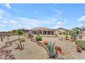 Expansive backyard featuring desert landscaping, including cacti, agave, and crushed gravel at 17179 S 174Th S Dr, Goodyear, AZ 85338