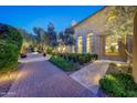 Stunning exterior view showcasing the estate's architecture and manicured landscaping at 18927 N 101St St, Scottsdale, AZ 85255