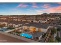 Picture of a backyard featuring a lovely pool, lounge area, and manicured landscaping at 20426 E Arroyo Verde Dr, Queen Creek, AZ 85142