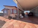Charming home featuring a covered carport and patio, perfect for enjoying the outdoors at 316 S 74Th Way, Mesa, AZ 85208