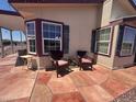 Cozy front patio seating area with comfortable chairs for relaxing and enjoying the outdoors at 316 S 74Th Way, Mesa, AZ 85208
