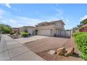 Beautiful two-story home with a long driveway and a gated side yard at 3806 E Taurus Pl, Chandler, AZ 85249