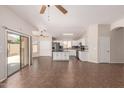 Open floorplan with an island and access to a bright kitchen equipped with stainless steel appliances at 385 E Ironwood Dr, Chandler, AZ 85225