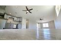 Open-concept living space featuring recessed lights, ceiling fans, and a view of the kitchen at 4219 W Citrus Way, Phoenix, AZ 85019