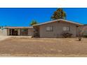 Charming single story home with a front yard and covered parking at 5738 W Heatherbrae Dr, Phoenix, AZ 85031
