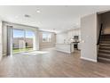Bright open-concept living room with tile floors, recessed lighting, and sliding glass doors at 5844 E Covey Ln, Phoenix, AZ 85054