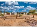 View of home with detached garage and desert landscaping, a new roof, and a fresh exterior paint job at 639 N 102Nd Pl, Mesa, AZ 85207