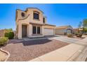 Charming two-story home with a two-car garage and low-maintenance desert landscaping at 6505 S 15Th Dr, Phoenix, AZ 85041