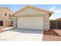 A clean two-car garage with a well-maintained driveway, offering plenty of parking and storage space at 6875 W Townley Ave, Peoria, AZ 85345
