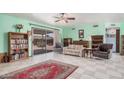 Bright living room featuring tile flooring, a sliding door, and neutral decor at 916 W Loughlin Dr, Chandler, AZ 85225