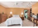 Cozy main bedroom features neutral walls, tile flooring, and ample natural light at 916 W Loughlin Dr, Chandler, AZ 85225