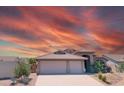 Inviting single-Gathering home with a well-maintained front yard and a convenient three-car garage at 11424 S Obispo Dr, Goodyear, AZ 85338