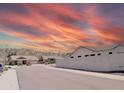 Peaceful neighborhood street featuring well-kept homes and desert landscaping at 11424 S Obispo Dr, Goodyear, AZ 85338