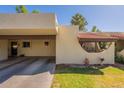 Inviting front exterior featuring desert landscaping, covered parking, and stylish architectural details at 131 N Higley Rd # 41, Mesa, AZ 85205