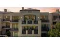 Luxury home showcasing multi-level balconies with outdoor seating, offering stunning views and elegant architectural design at 2 Biltmore Est # 313, Phoenix, AZ 85016