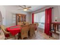 Bright dining room featuring natural light, tile floors, and seating for six at 2033 E Hillery Dr, Phoenix, AZ 85022