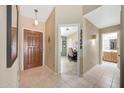 Inviting home entryway with tile flooring and views to the office and bathroom areas at 20739 N 106Th Ln, Peoria, AZ 85382