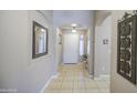 Welcoming home entryway showcasing an arched doorway, neutral paint, and tile flooring at 22333 E Calle De Flores St, Queen Creek, AZ 85142