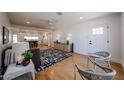 Cozy living room with hardwood floors, stylish furnishings, and an open layout to the modern kitchen at 228 E Del Rio Dr, Tempe, AZ 85282