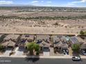 Residential street view showcasing well-maintained homes with desert landscaping and mountain views at 22812 N 123Rd Dr, Sun City West, AZ 85375