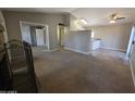View of open living room and kitchen area, including fireplace, and closet space at 2515 S Maple Ave # 103, Tempe, AZ 85282