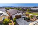 Desirable neighborhood aerial showcasing manicured lawns, tile roofs, and the home's prime location near green spaces at 4352 N 91St Gln, Phoenix, AZ 85037