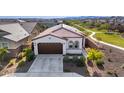 Expansive aerial view of a well-maintained home with a tile roof, landscaped yard, and walking path at 4352 N 91St Gln, Phoenix, AZ 85037