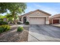 Single-story home with neutral stucco and an attached two-car garage, set against a bright blue sky at 4466 S Brice --, Mesa, AZ 85212