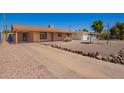 Attractive single-story home boasting desert landscaping and a covered parking area at 4545 N 49Th Ave, Phoenix, AZ 85031