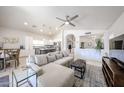 Bright and spacious living room with a large sectional sofa and open floor plan at 4765 E Charleston Ave, Phoenix, AZ 85032