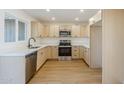 Fully renovated kitchen with light wood cabinets, stainless steel appliances, and white countertops at 6601 N 46Th Ln, Glendale, AZ 85301