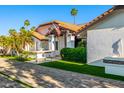 Beautiful property featuring meticulously maintained landscaping and a tiled roof at 6941 W Voltaire Ave, Peoria, AZ 85381