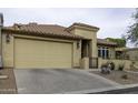 Lovely home featuring a two-car garage, desert landscaping, and a secure gated entry at 943 E Kortsen Rd # 2, Casa Grande, AZ 85122