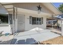Charming single story home featuring a covered front porch with decorative railings and a star accent at 120 S Olive --, Mesa, AZ 85204